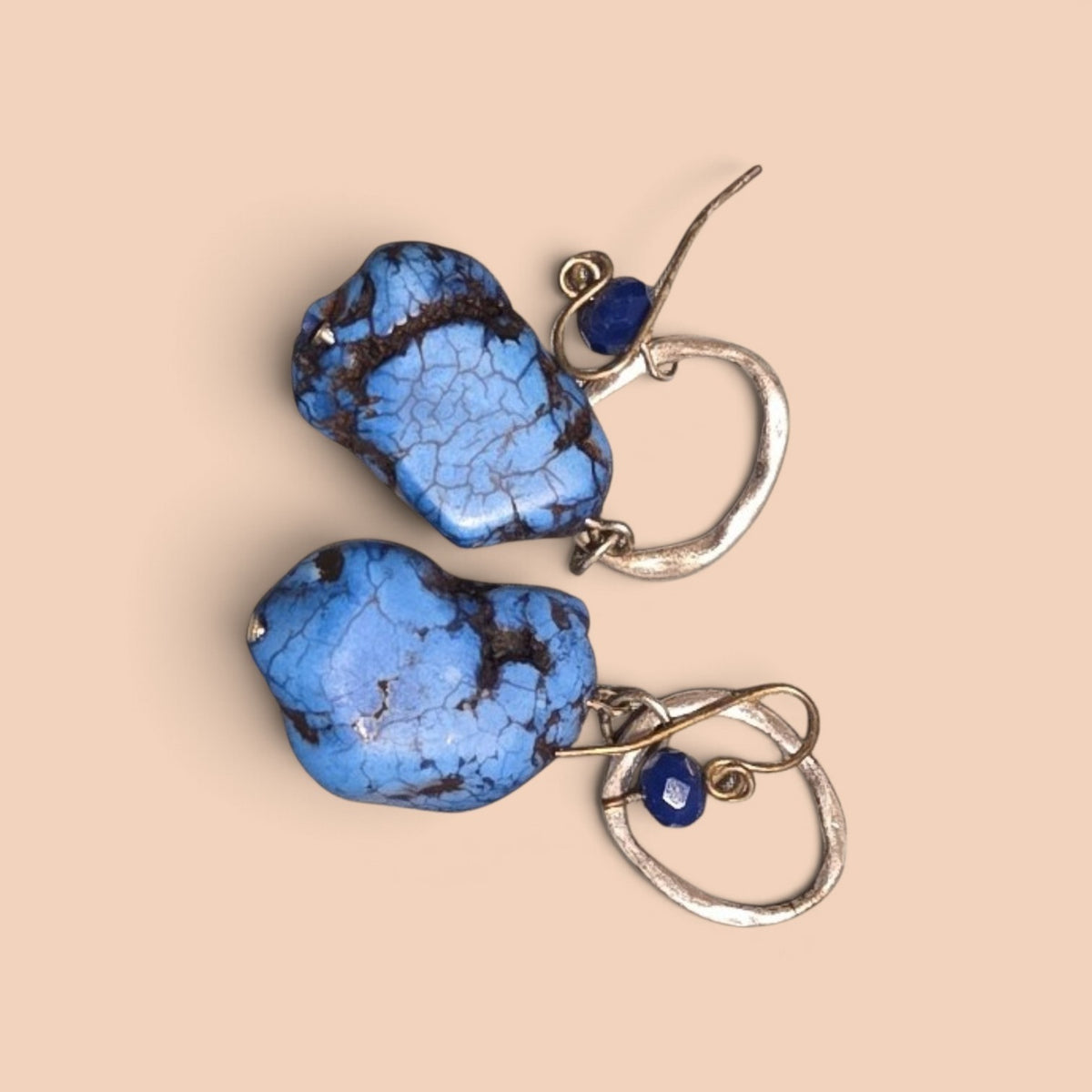 Blanca Closet blue turquoise drop earrings with raw stone pendants and small accent beads on hammered silver hooks.