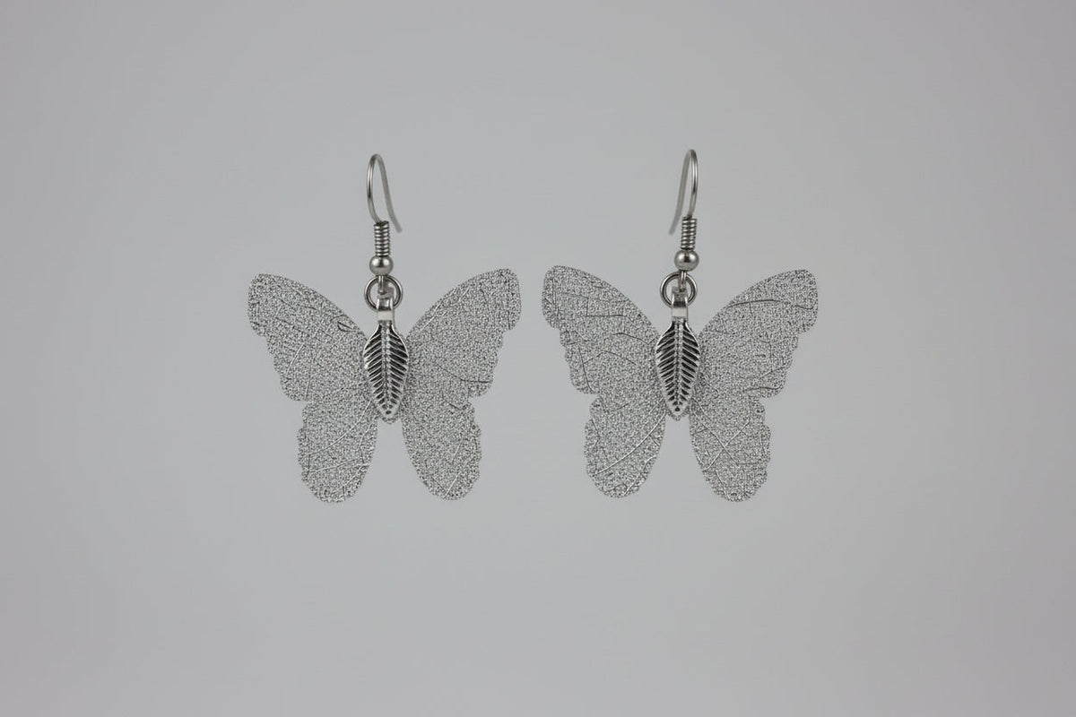 Blanca Closet brown butterfly earrings with delicate textured wing silhouettes and silver-tone hook findings.