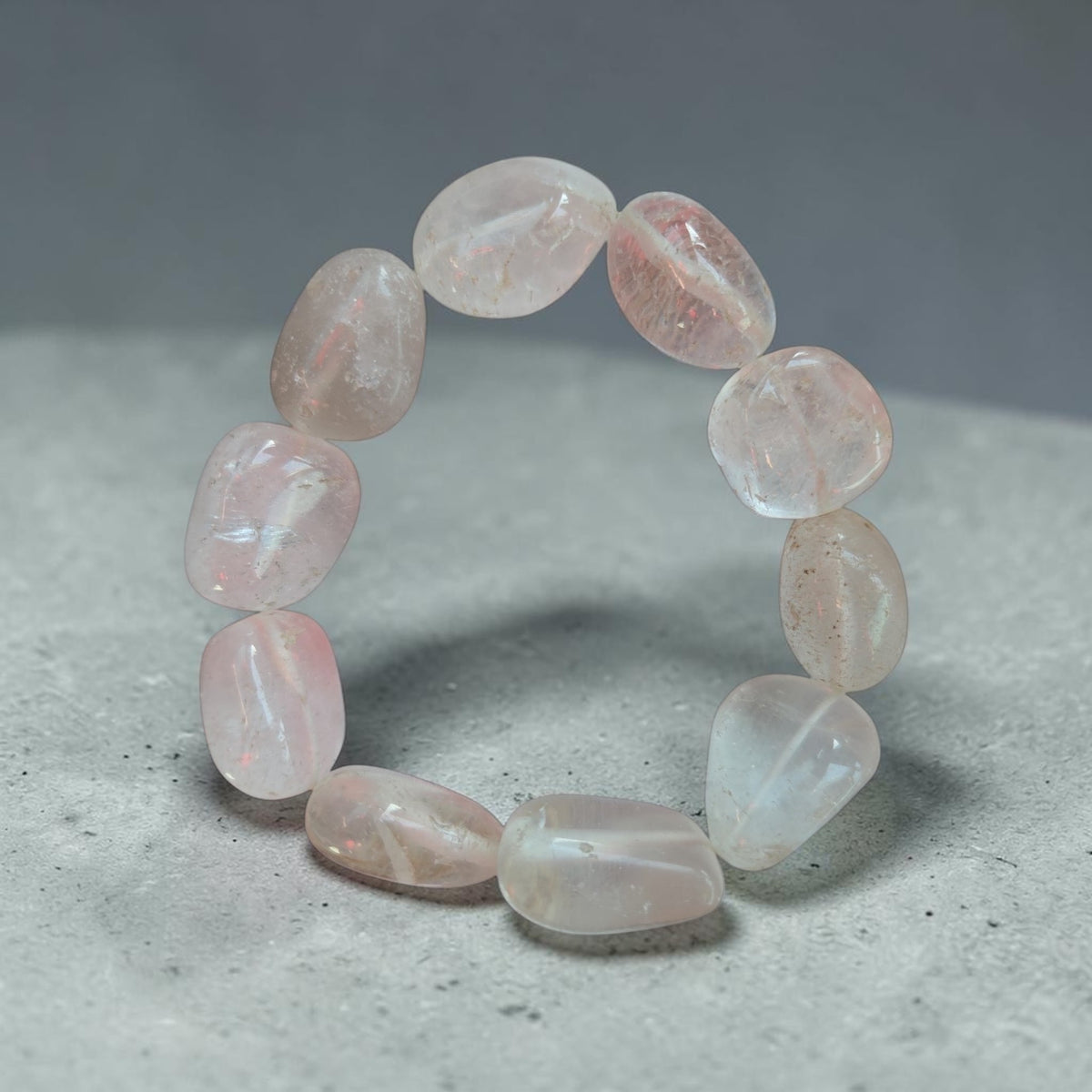 Blanca Closet crystal quartz bracelet featuring polished tumbled stones in a soft translucent pink hue.