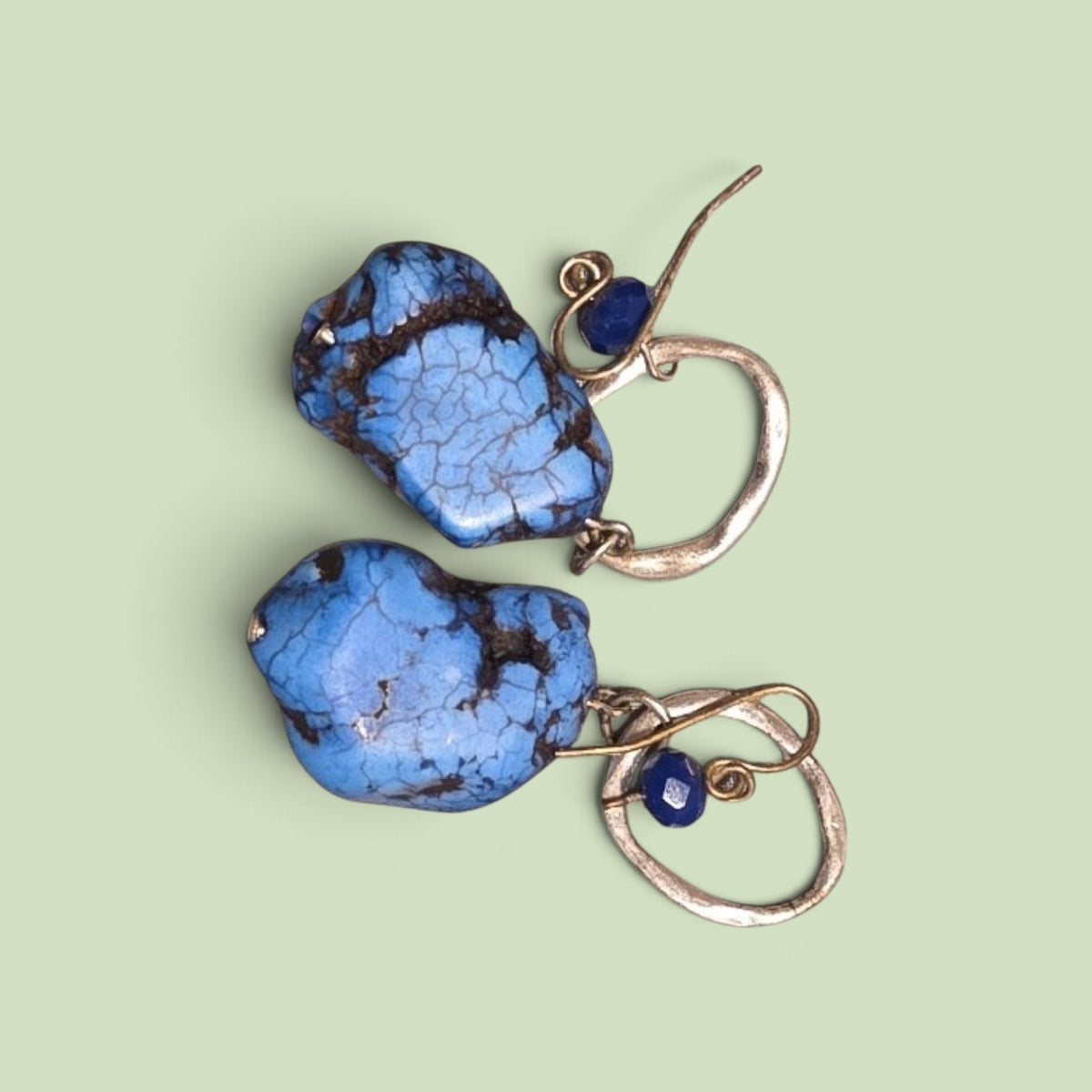 Blanca Closet blue turquoise drop earrings featuring raw, veined stones and small dark blue bead accents on silver hooks